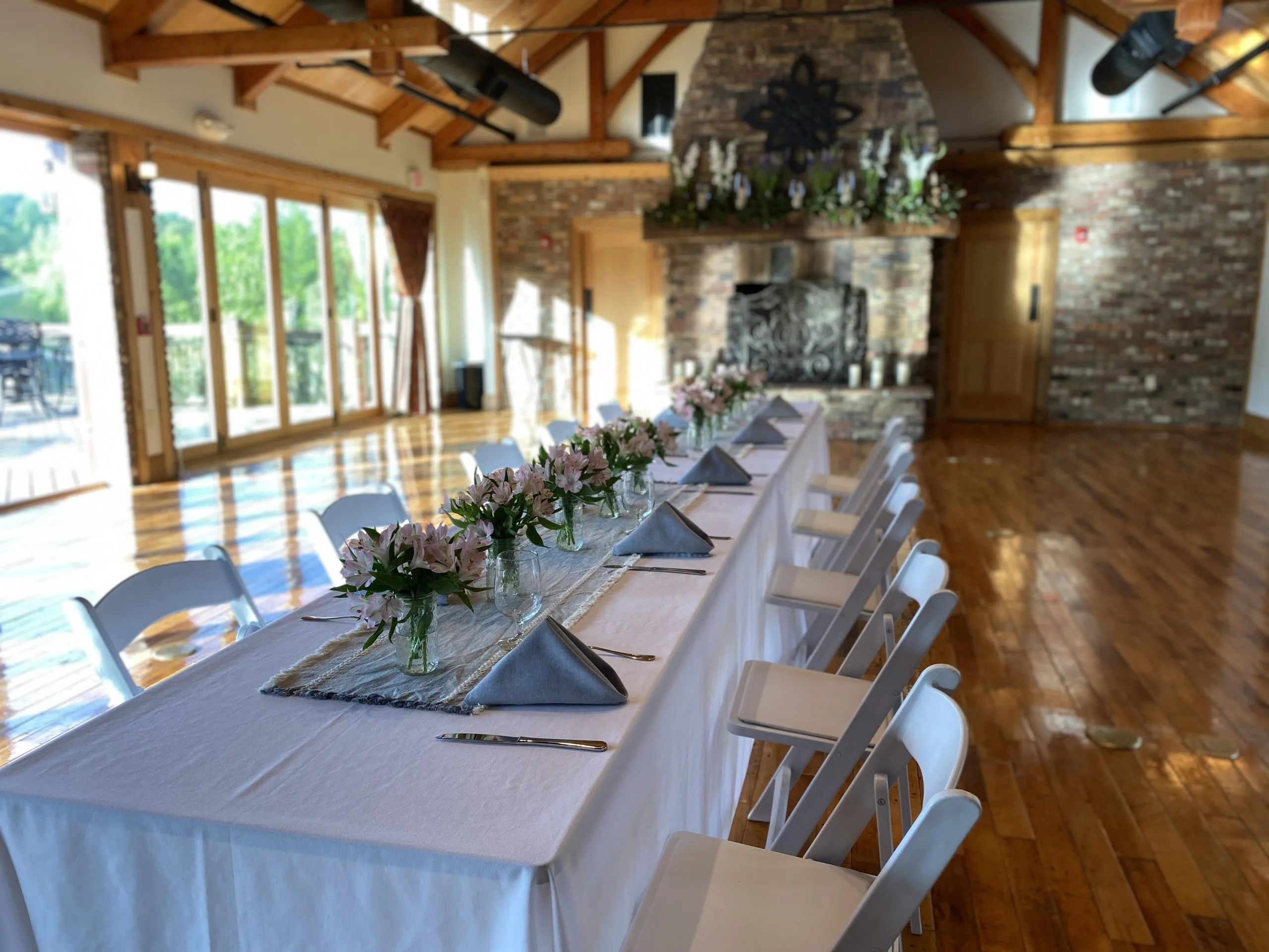 A long, white-tableclothed banquet table in our Conference Center